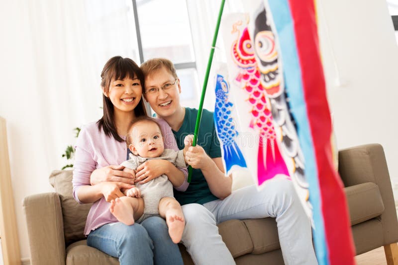 Mixed-race family with koinobori carp streamer