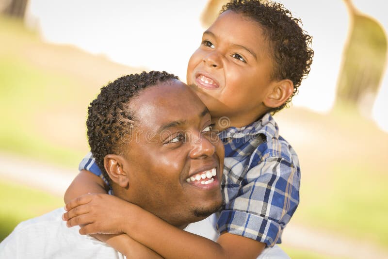 Cheerful african american father giving son piggyback ride outdoors  smiling, Happiness family concepts 6774671 Stock Photo at Vecteezy
