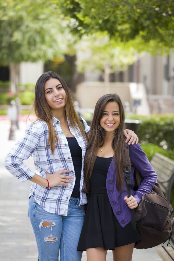 Mixed Race Female Couple Carrying Backpacks On School Campus Stock Image Image 32725381