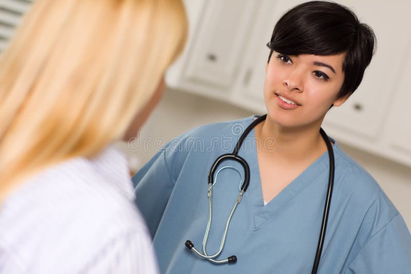 Mixed Race Young Female Doctor and Patient