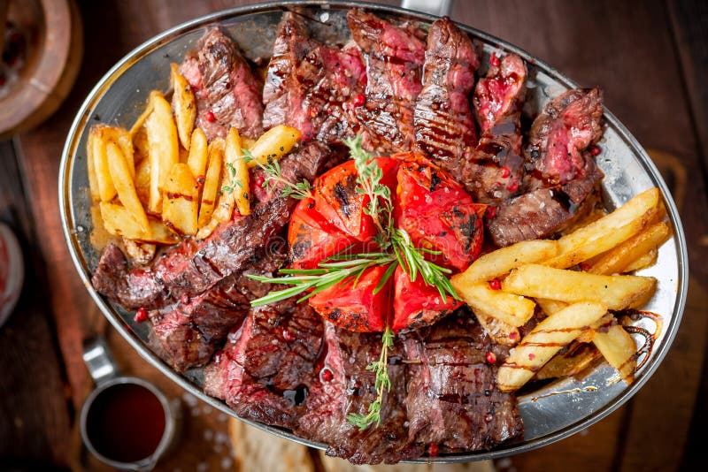 Mixed roast beef steaks set on a plate of tenderloin and Striploin. Barbecue menu