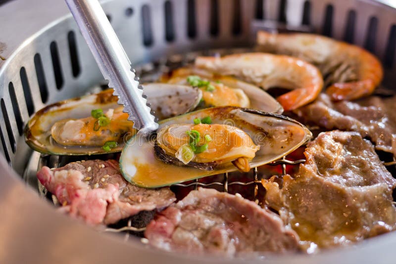 Mixed Roasted Meat and Seafood on the BBQ Grill on roast.