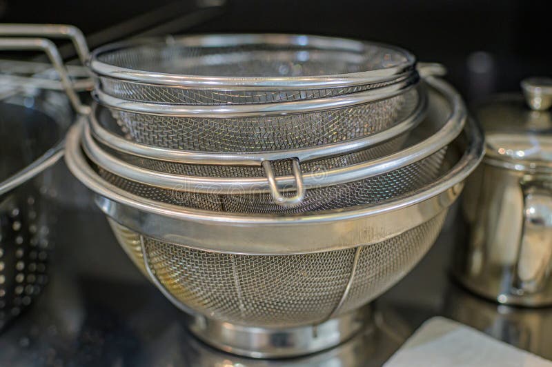 A Mixed Stack of Stainless Steel Strainers. Stock Photo Image of
