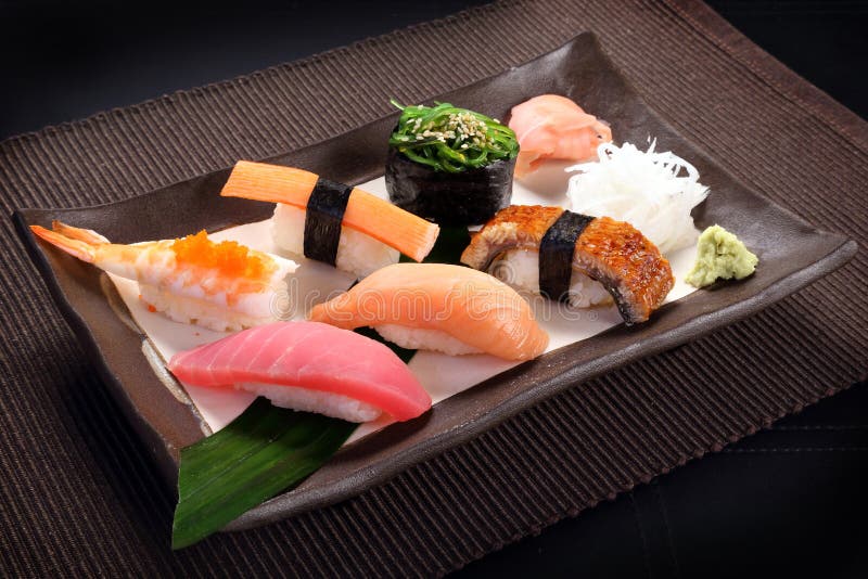 Mixed sushi set with wasabi on ceramic dish, sweet boiled shrimp stock images Mixed sushi set with wasabi on ceramic dish, sweet boiled shrimp stock images