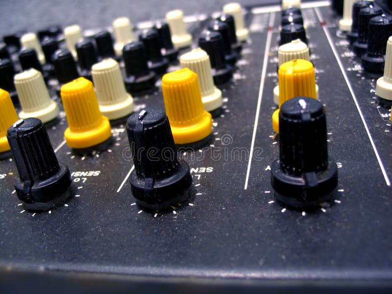 Mixer Knobs. This is a macro shot of a studio mixing board showing a close up of the tuning knobs. Amp knobs stock images, royalty-free photos and pictures