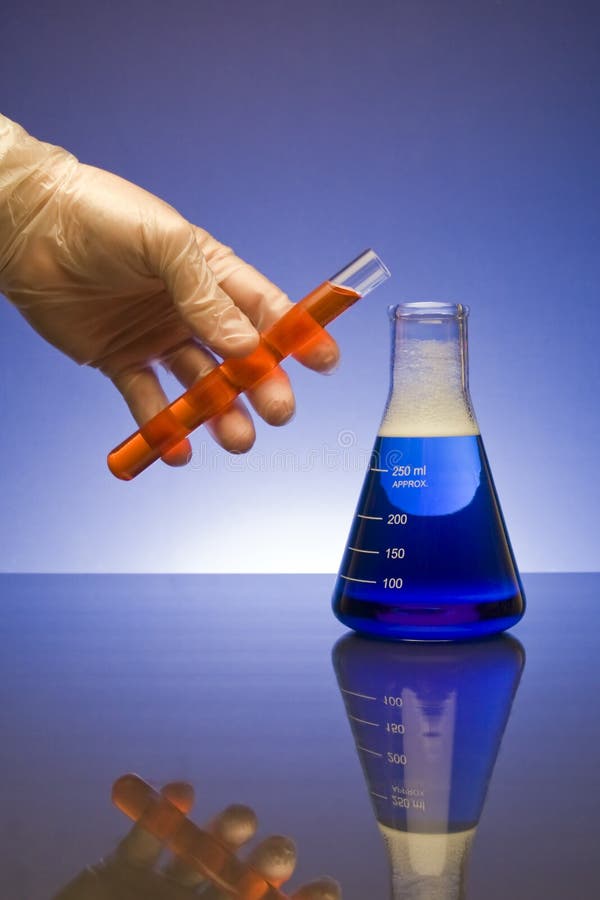 Mixing Chemicals stock image. Image of hand, glass, measure 9174973