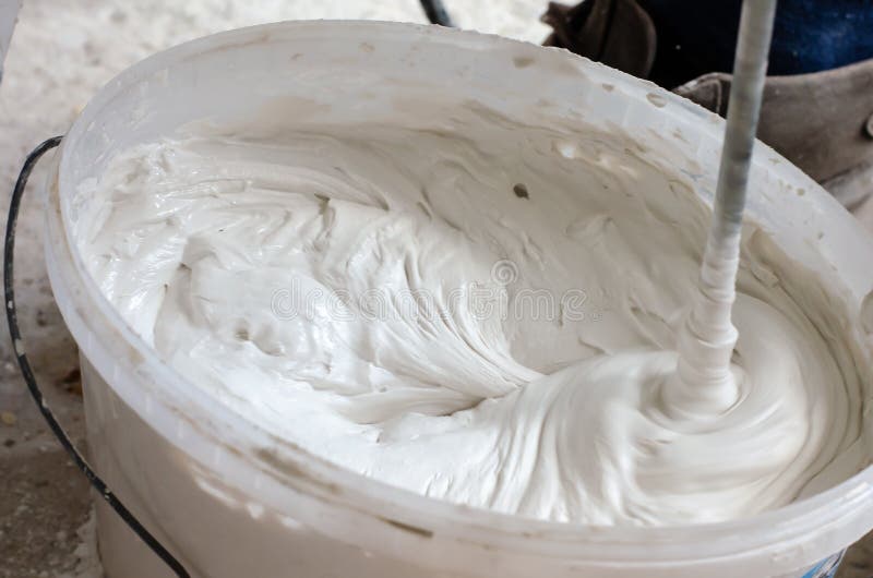Mixing Putty Solution in a Pail. Construction Works Stock Photo Image of concept, mortar