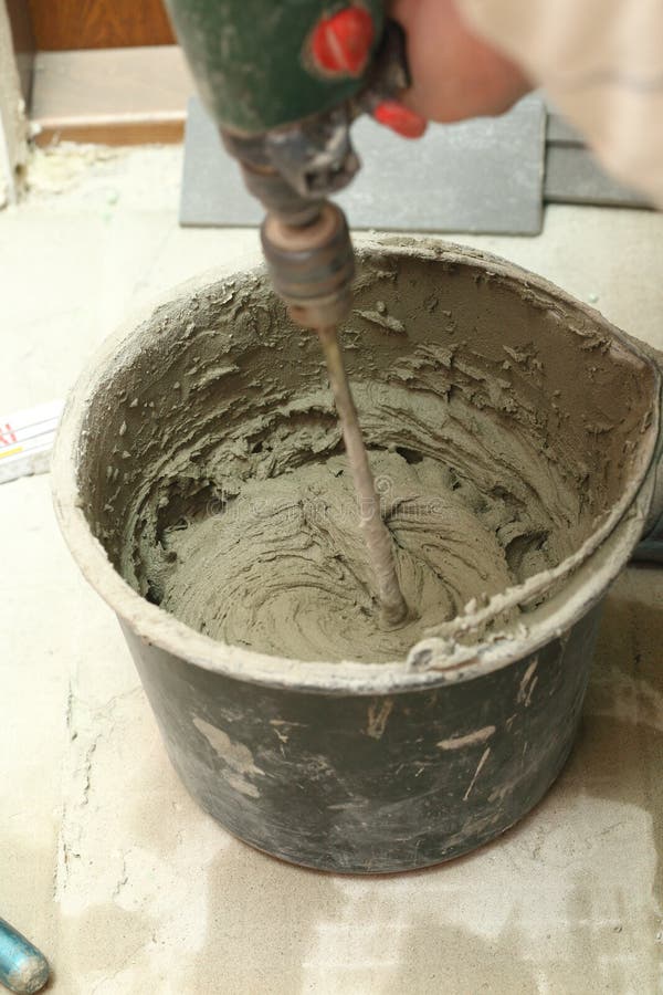 Mixing Tile Adhesive or Cement with a Power Drill Stock Photo Image