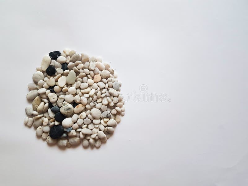 A Mixture of White Pebbles and Black Pebbles. Background of Pebbles