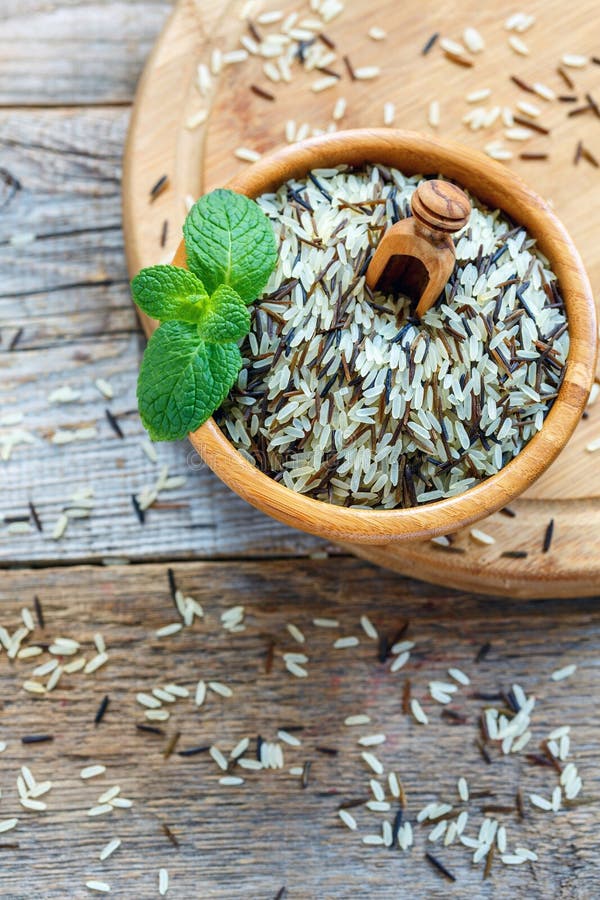 Mixture of White and Wild Rice in a Wooden Bowl. Stock Photo - Image of