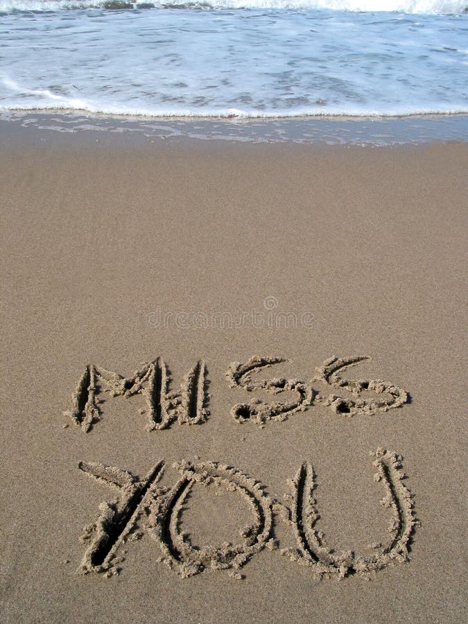 Words miss you written on the sand. Words miss you written on the sand
