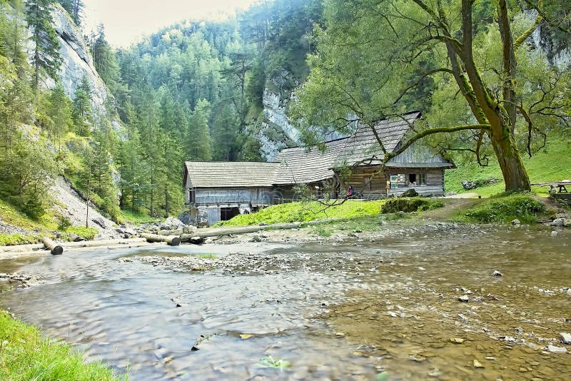 Mlyny - Oblazy building a wooden water mill in Kvacany Valley.