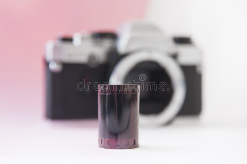35 Mm Negative Film Roll on Blurry SLR Camera Background Stock Photo Image of product, history