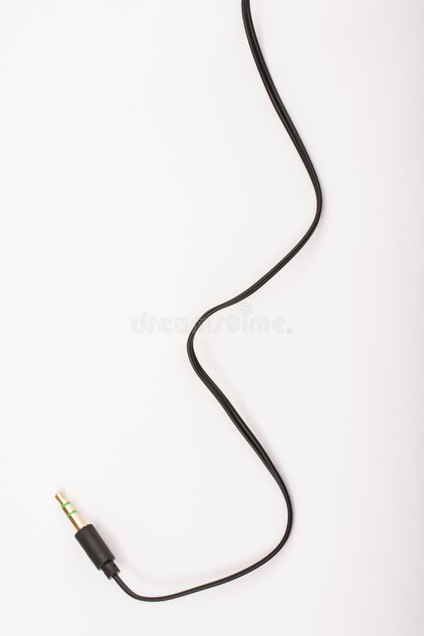 3.5mm headphone jack with wire lies on a white background isolate. 3.5mm headphone jack with wire lies on a white background isolate