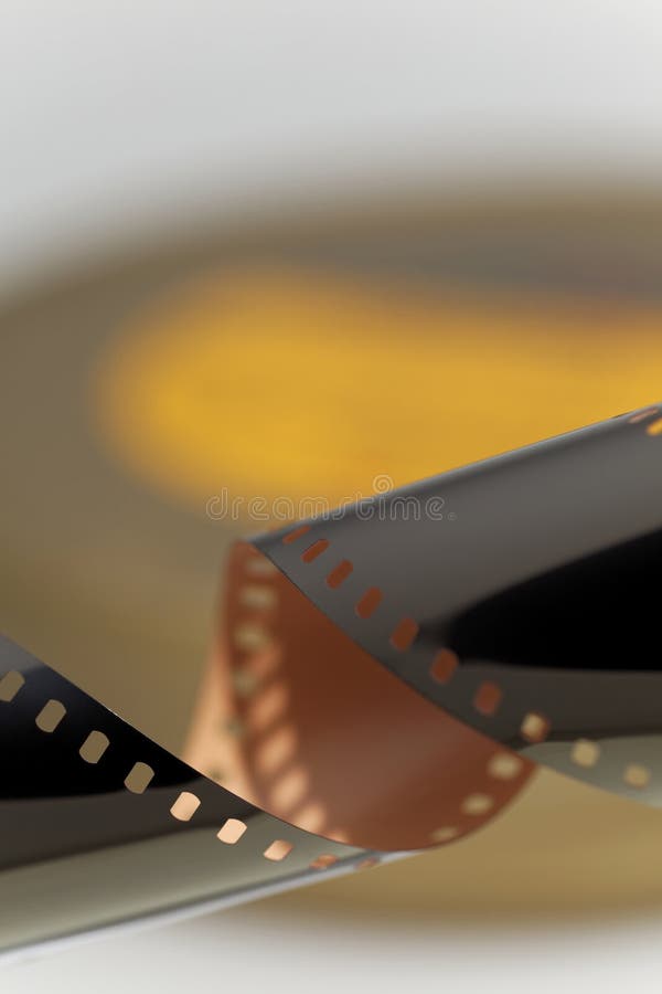 35 mm unprocesed motion picture film for professional cinematography with original film can. Selective focus. 35 mm unprocesed motion picture film for professional cinematography with original film can. Selective focus.