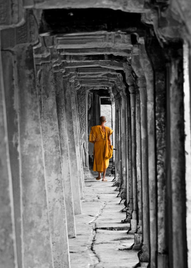 Buddhist Monk at Angkor Wat Monastry, Cambodia, black and white/orange. Buddhist Monk at Angkor Wat Monastry, Cambodia, black and white/orange.