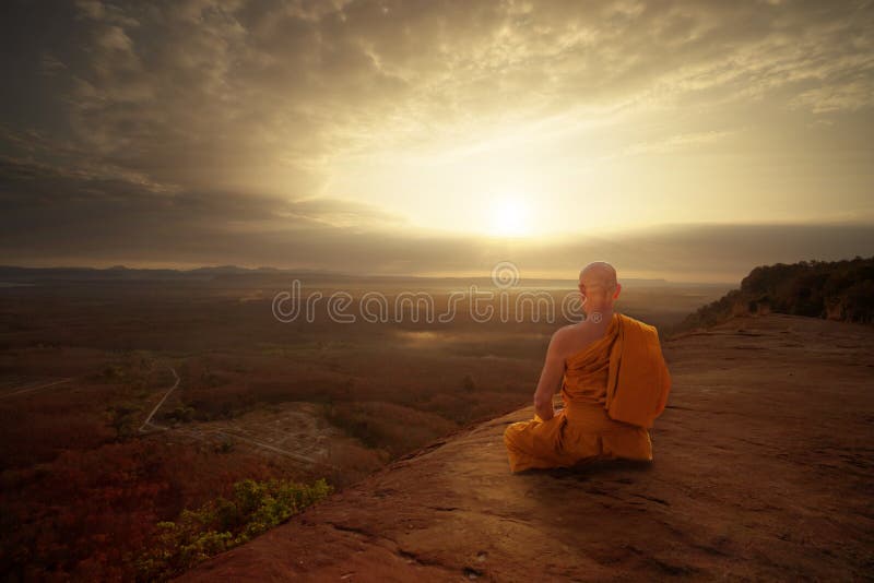 Buddhist monk in meditation at beautiful sunset or sunrise background on high mountain. Buddhist monk in meditation at beautiful sunset or sunrise background on high mountain