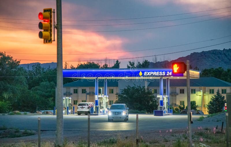 MOAB, UT JUNE 22, 2018 Express 24 Gas Station Sign at Sunset
