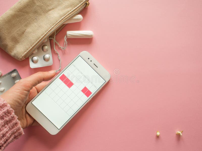 Mobile application to track your menstrual cycle and for marks. PMS and the critical days concept. royalty free stock photo
