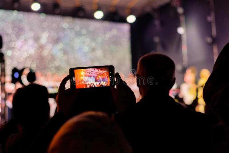 Mobile Camera Filming the Performance of the Concert Editorial