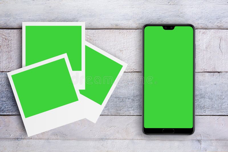 Mobile with Green Screen Next To Some Photo Frames on a White Wooden  Desktop. Chroma Key for Mock Up Project and Empty Copy Space. Stock Image -  Image of media, message: 171651259