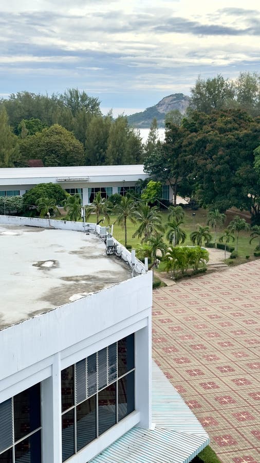 Mobile Network Antenna Installed on Building Facing Target Direction. Mobile network antenna mounted on building edge facing target area perfect for telecommunications infrastructure or urban technology scenes