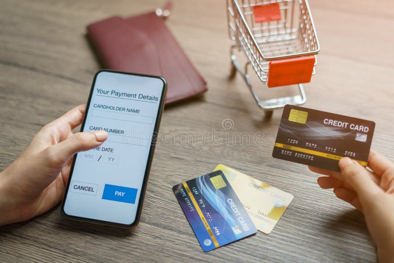 Mobile payments. hands using smartphone and credit card for online shopping stock photography