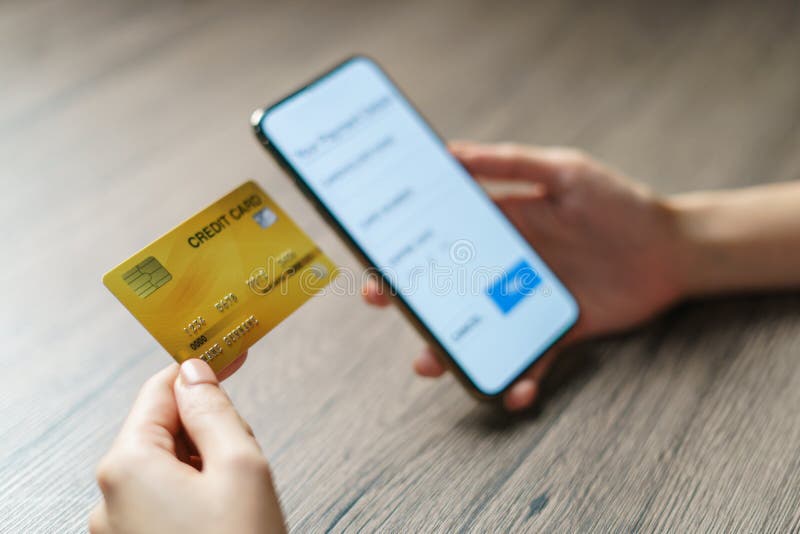 Mobile payments. hands using smartphone and credit card for online shopping royalty free stock photo