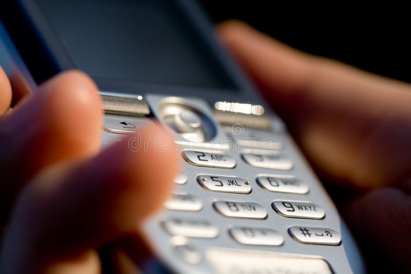 Mobile phone. Hand holding mobile phone keypad Mobile phone. Hand holding mobile phone keypad