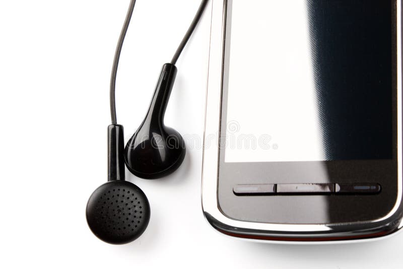 Mobile phone and ear buds royalty free stock image
