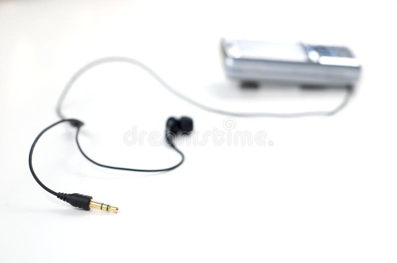 Mobile phone with earphones isolated on white, focus on the jack plug. Single mini stock images, royalty-free photos and pictures