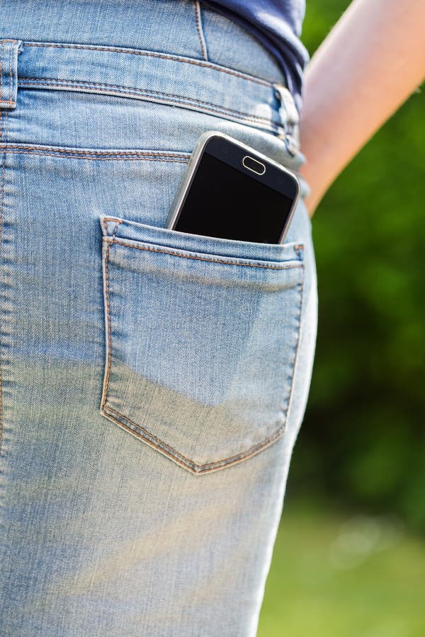 Mobile phone in pocket stock photo. Image of caucasian 78102962