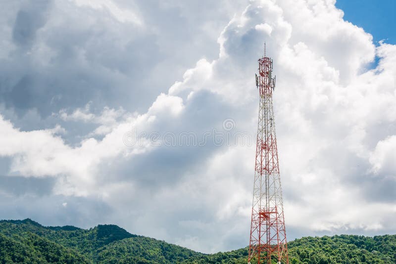 Mobile phone telecommunication tower with white cloud