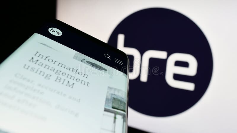 Stuttgart, Germany - 03-17-2023: Mobile phone with website of Building Research Establishment (BRE) on screen in front of logo. Focus on top-left of phone display. British standards logo stock images, royalty-free photos and pictures
