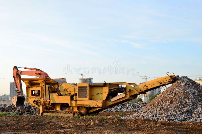 Mobile Stone Crusher Machine By The Construction Site Or Mining Quarry For  Crushing Old Concrete Slabs Into Gravel And Subsequent Cement Production.  Stock Photo, Picture and Royalty Free Image. Image 130474849.