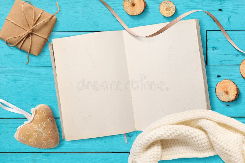 Mock up Blank open Notepad, Christmas gifts on a turquoise wooden background with space for your text royalty free stock photo Mock up Blank open Notepad, Christmas gifts on a turquoise wooden background with space for your text royalty free stock photo