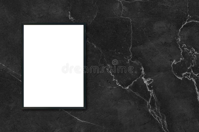 Mock up blank poster picture frame hanging on black marble wall in room