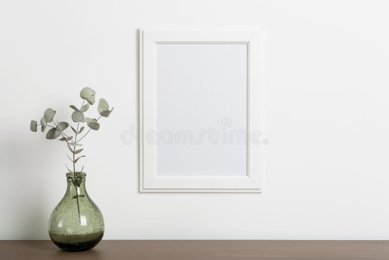 Mock up empty white frame background. Empty frame for a photo or painting in a light Scandinavian minimalist interior on