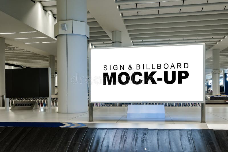 Mock up large blank horizontal billboard at baggage claim point stock photo