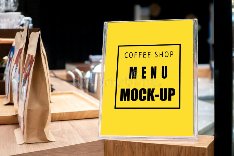 Mock up vertical signboard with acrylic frame in coffee shop royalty free stock photo