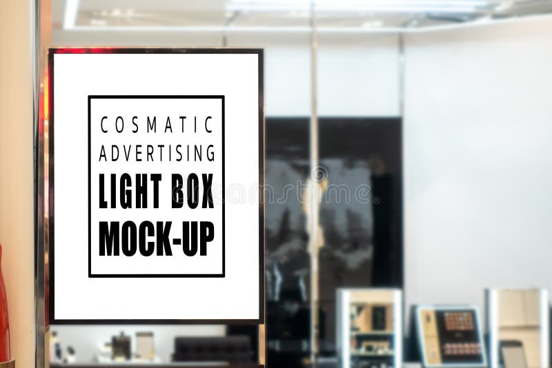 Mock up vertical signboard on glass panel of cosmetic shop stock photos