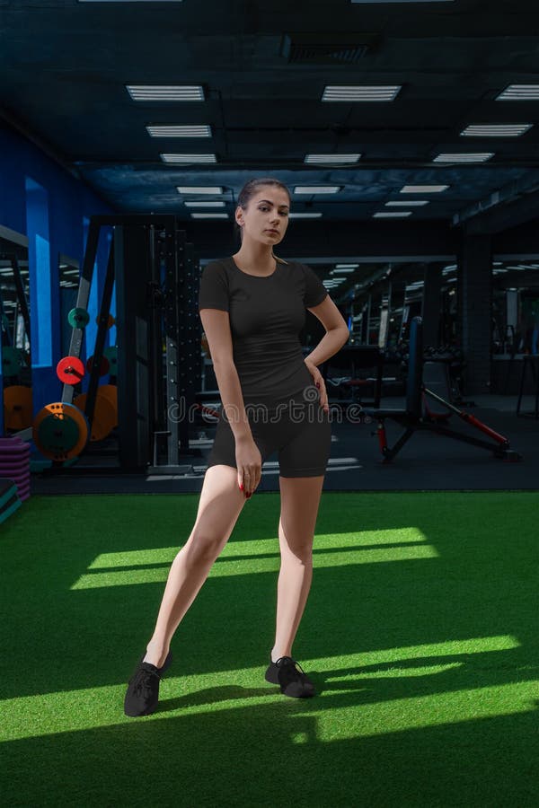 Mockup of a White Women`s T-shirt, Shorts, Compression Underwear for Sports  on a Girl, Against the Background of Equipment in the Stock Photo - Image  of clothes, retail: 225161580