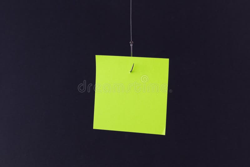 Mockup of a Blank Orange Memo Paper with Copy Space Hanging on a