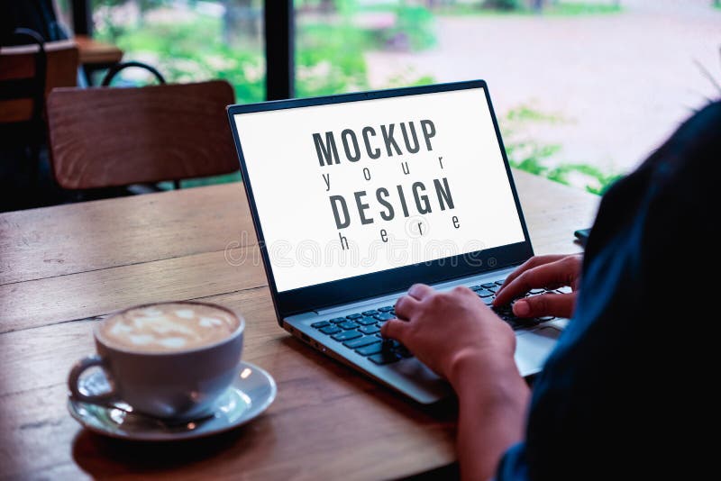 Mockup image of a business woman using and typing on laptop computer keyboard with blank white desktop screen with coffee latte cup on wooden table, background, cafe, casual, communication, concept, copy, display, empty, female, freelance, girl, home, internet, looking, modern, monitor, network, notebook, office, online, over, people, person, shop, shoulder, sitting, space, technology, touching, touchpad, workplace, workspace