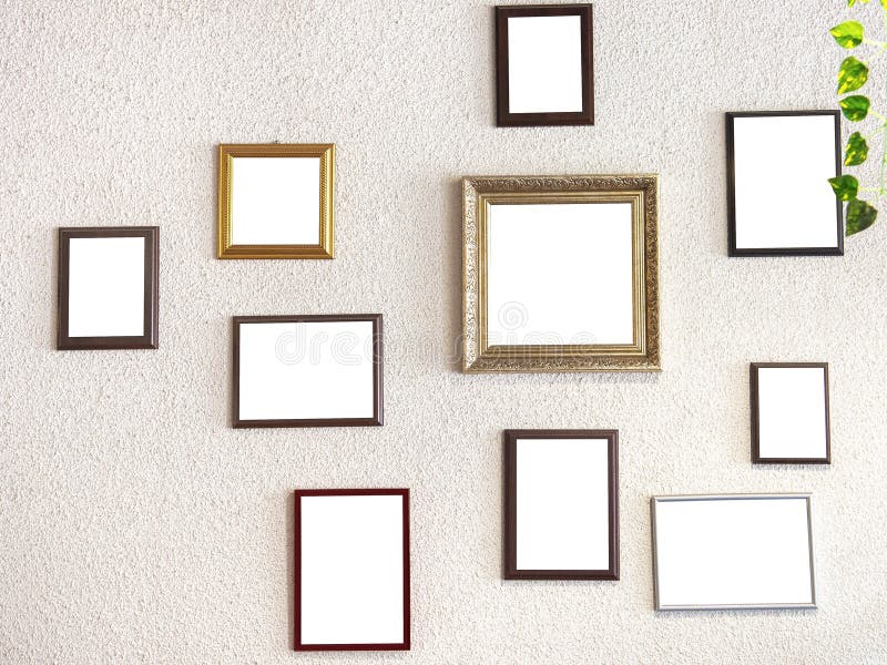 Mockup image. different size picture framed hanging on the gray wall. Various many blank small picture frames on grey wall royalty free stock photo