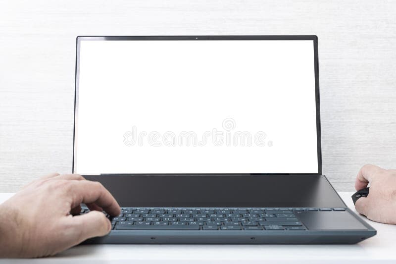 Mockup image of hand using laptop with blank white screen on white background royalty free stock images