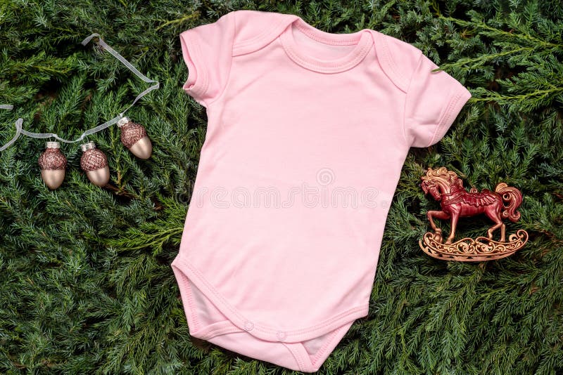 Mockup pink blank template bodysuit with copyspace and Christmas decor