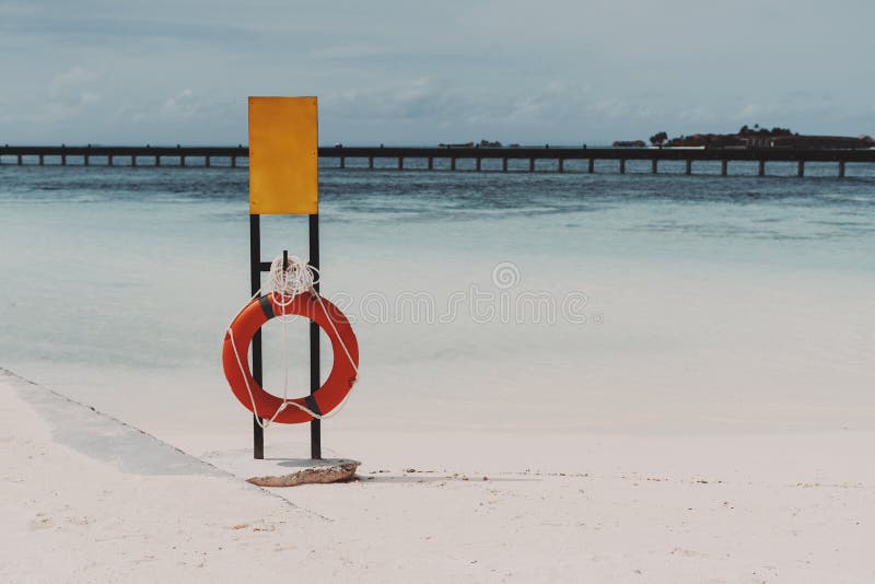Download Mockup Of Safety Banner On The Beach With The Lifebuoy ...