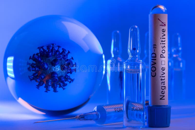 Mockup of virus in a glass sphere, positive covid-19 test, ampules with medicine or vaccine from coronavirus.