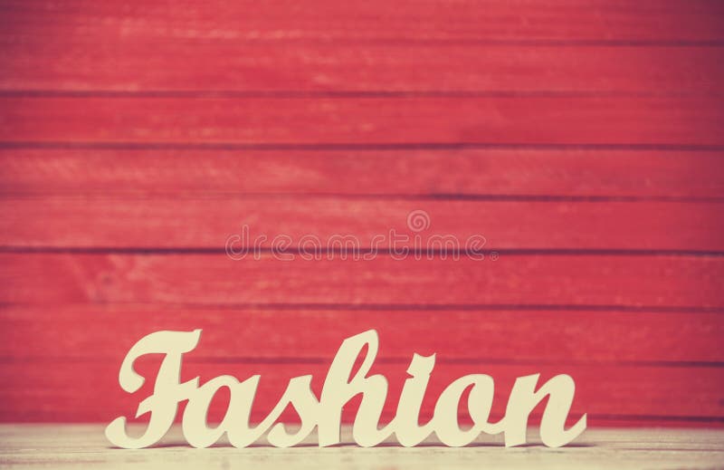 Wooden word Fashion on red background. Wooden word Fashion on red background.